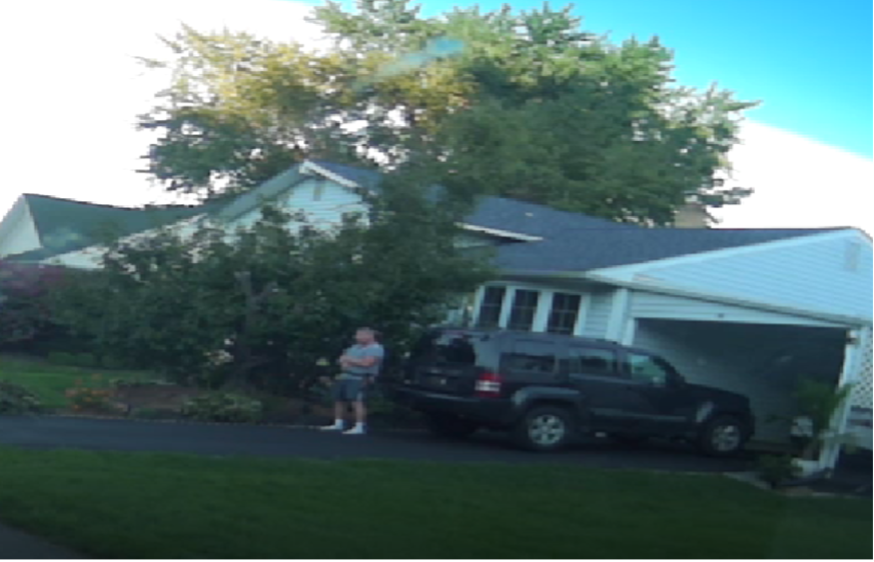 Schneider standing in the driveway