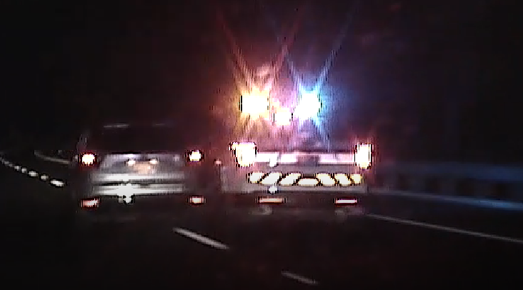 Screenshot from the PSP dashcam footage, showing the stolen Ford Escape on the right and the PSP lead vehicle on the left, being pushed into the median.