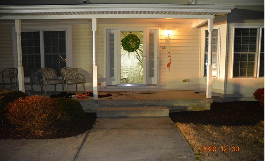 Photo showing front porch of nearby residence where Cochran was located.