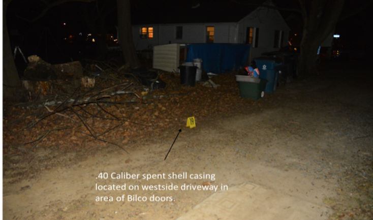 .40 caliber spent shell casing located on westside driveway in area of Bilco doors.