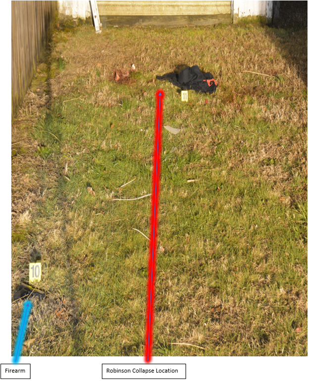 Close-up of location where Robinson collapsed; firearm visible on left