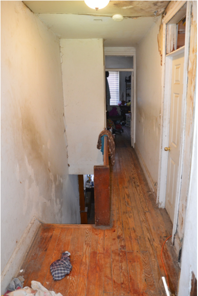 Perspective of Cpl. Crocker showing room from which Burton exited. Blood transfer on floor shows Burton's final resting place.